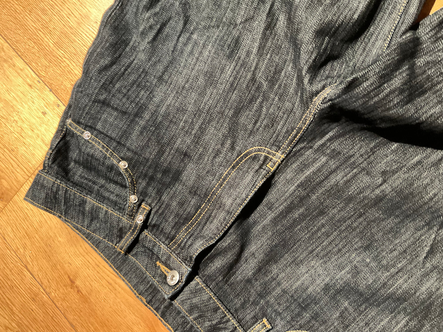 “STUDDED RAW DENIM”