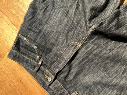 “STUDDED RAW DENIM”